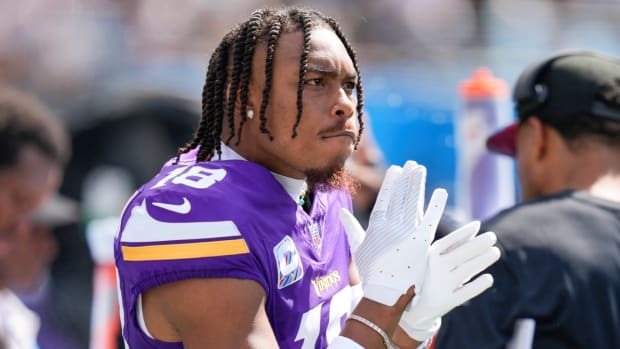 Vikings receiver Justin Jefferson reacts to a play on the sidelines.